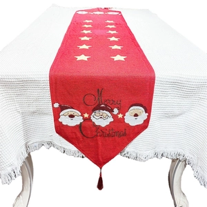 Red Christmas table runner with Merry Christmas print, Santa Claus motif and tassels