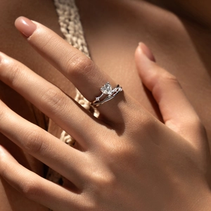 Elegant S925 sterling silver crisscross ring with heart-shaped moissanite on a model