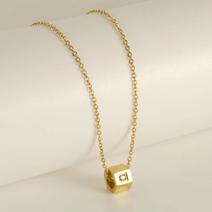 18K gold plated stainless steel chain with a square zircon pendant on a white display