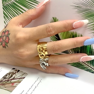 Polished stainless steel chain ring for women in gold and silver finish on hand