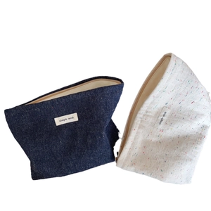 Retro denim and canvas trapezoid cosmetic pouch with minimalist fabric label