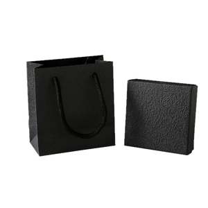 Minimalist black jewelry gift box and paper shopping bag set with textured finish