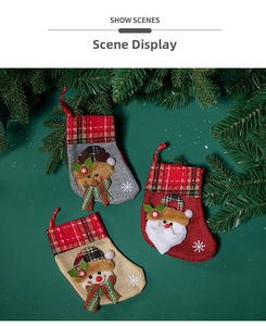 Three-pack Christmas stockings with reindeer, Santa, and snowman designs on a rustic burlap