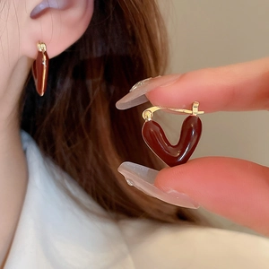 Vintage deep red V-shaped heart earrings with gold hooks and drip oil finish