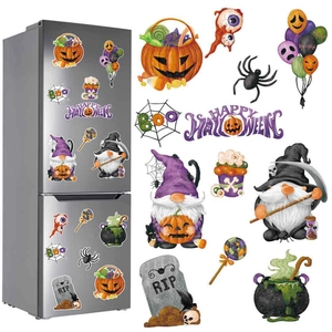 Detail of Halloween gnome and pumpkin magnetic stickers on a silver refrigerator surface