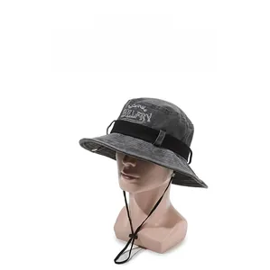 Detail view of dark grey bucket hat with BELFRY embroidery and adjustable wind cord
