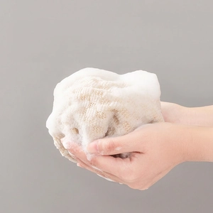 Exfoliating bath scrubber with rich foam and natural sisal texture for skin cleansing