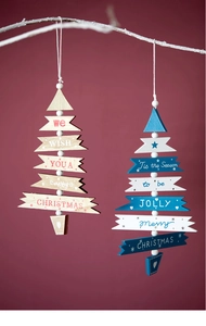 Detail of wooden Christmas tree ornaments with festive greetings on white branches