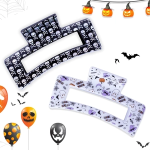 Detail of Halloween hair claws with skull and ghost prints on acetate material
