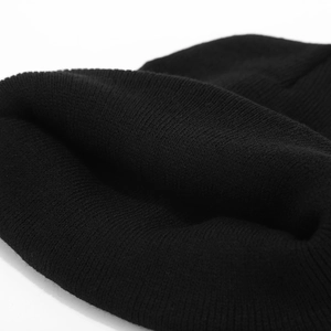 Minimalist black knit beanie featuring a puppy patch and stylish ribbed texture design