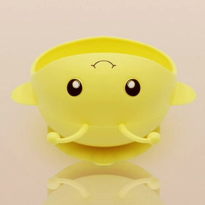 Close-up of a yellow bee-shaped silicone baby bowl with soft textures and cute antenna details
