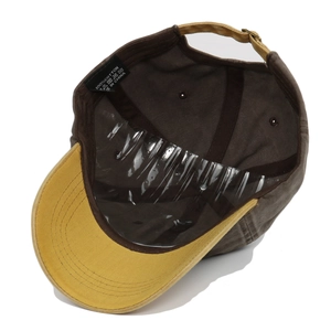 Detail of 100% cotton washed baseball cap interior with metal buckle adjustment