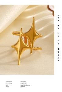 Detailed macro shot of 18K gold plated star ring on elegant champagne satin fabric