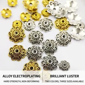 Macro view of detailed relief patterns on gold and silver plated alloy bead caps for DIY jewelry