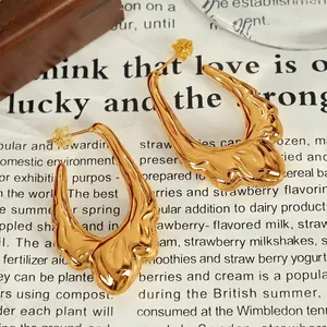 Chunky 18K gold-plated titanium steel hoop earrings with lava textured molten design