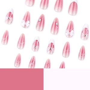 Pink cat eye gradient almond press-on nails with 3D bows and rhinestone accents