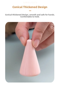 Close-up of a pink ceramic cone ring display stand with a smooth glossy glazed finish