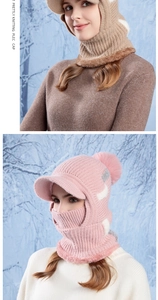 Close-up of knit hood hat with fleece lining and pom-poms for winter outdoor warmth