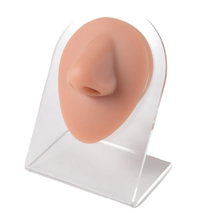 Silicone nose model for piercing practice with acrylic display stand on white background