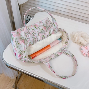 White floral jacquard tote bag with pink flower patterns and spacious interior with lining