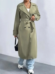 Elegant olive green long double-breasted trench coat with waist belt and wide lapels