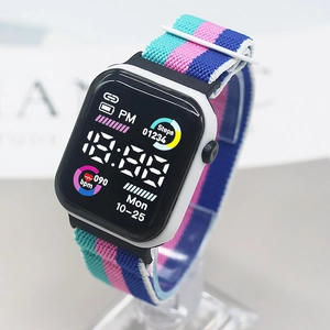 Square white digital sports watch with a colorful striped nylon band and heart rate display