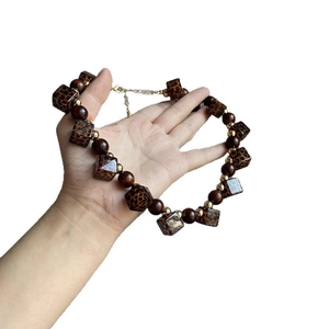 Retro leopard print acrylic and wooden bead necklace with gold spacers and chain extension