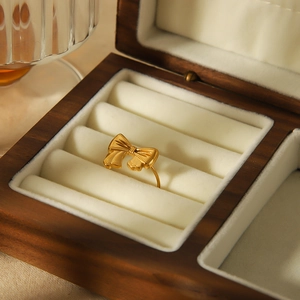 Elegant 18k gold plated stainless steel bow ring with an adjustable open design