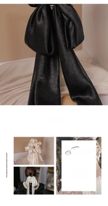 Close-up of elegant satin bow hair ties in black and beige with smooth silk texture