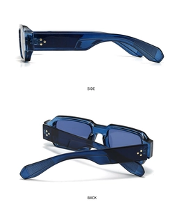 Detail view of square navy sunglasses with golden star rivets and polished frame design
