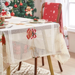Beige lace Christmas tablecloth with gold bell embroidery and festive floral patterns