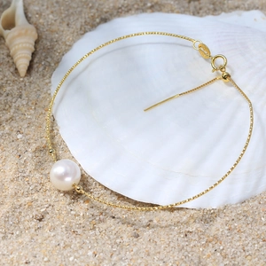 14K gold plated S925 silver bracelet with natural freshwater pearl on a beach shell