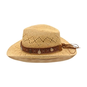 Detailed macro view of woven straw cowboy hat with bohemian metallic charms and fringe