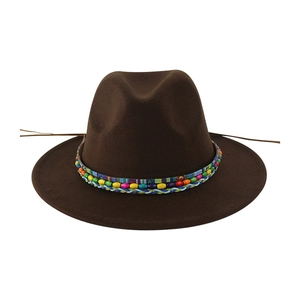 Detail of dark brown fedora hat featuring a colorful bohemian beaded ethnic hatband
