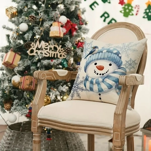 Housse de coussin de Noël en lin avec bonhomme de neige sur chaise près du sapin