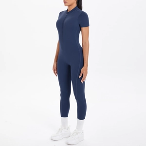 Detail of navy blue athletic jumpsuit with front zipper and high-stretch fabric