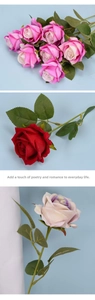 Close-up of velvet artificial roses with realistic petals and green serrated leaves