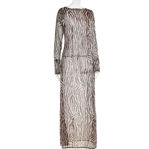 Detailed macro view of the semi-transparent zebra print mesh fabric and neckline