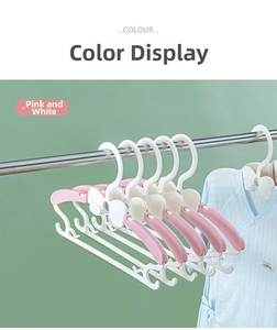 Detail of adjustable telescopic pink white children hangers with bowknot design
