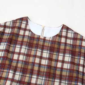 Plaid mini dress with a round neckline and back button detail in colorful checkered fabric