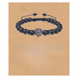 Detail of lion head bead on black matte stone bracelet with sentimental gift card