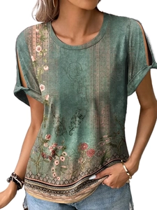 Detail of bohemian floral print and cold-shoulder cut with tie-up sleeves on green t-shirt