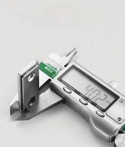 Macro shot of ultra-thin 4.02mm magnetic door catch with brushed metal finish