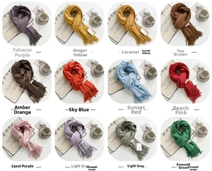 Grid view of soft winter scarves in 12 colors including purple and ginger with fringe