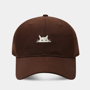 Close-up of a dark brown cotton baseball cap featuring a minimalist white cat embroidery