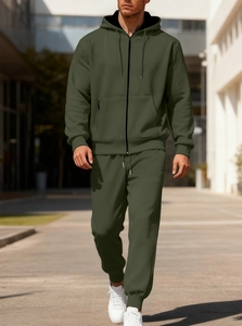 Outdoor shot of men's olive green fleece tracksuit with hooded jacket and drawstring pants