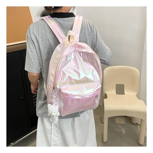 Pink laser holographic backpack detail showing shiny surface and cute bear charm pendant