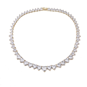 Detail of gold heart tennis necklace featuring clear cubic zirconia and fold-over clasp