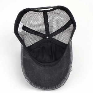 Detailed interior of gray distressed baseball hat featuring mesh back and adjustable strap