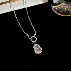 Elegant silver gourd pendant necklace with grey moonstone and pavé diamonds on black background